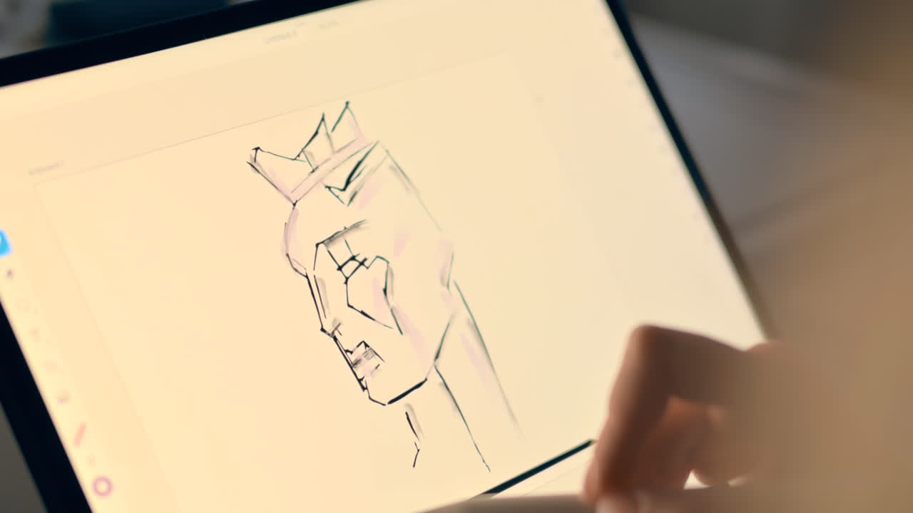 Woman sketching a face on a tablet with a stylus pen