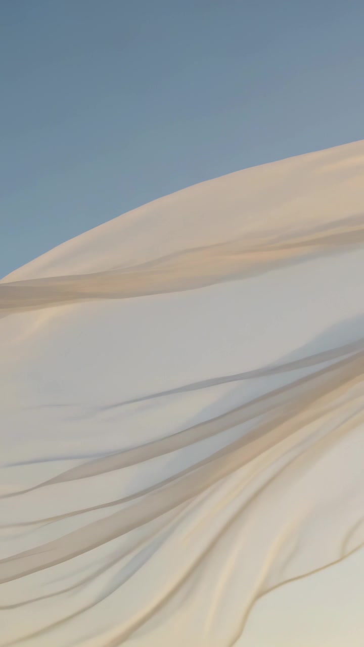 Vertical video: Lifting sheer beige panels billowing over open sky with breeze lifting, thin cord