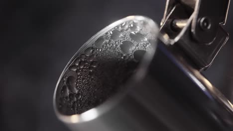 hot water pouring into a cup