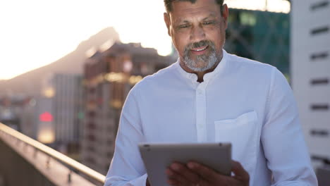 architecture, buildings and man typing on tablet