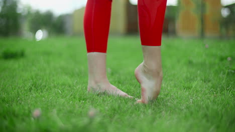 woman doing yoga in the grass