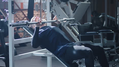 disabled man weightlifting in gym