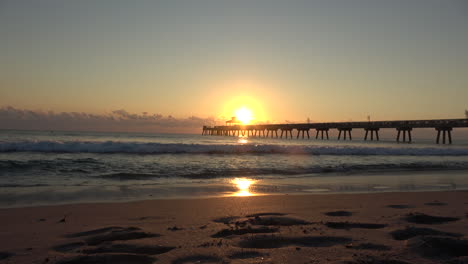 wide shot of sunrise sunset at pier in florida