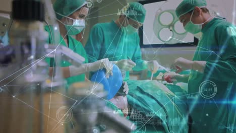red de conexiones contra un grupo de cirujanos que realizan una operación en la sala de operaciones
