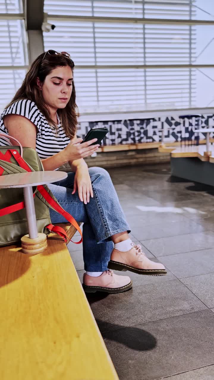 Woman Watching Video Content On Mobile Phone Screen