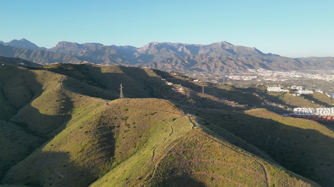 Aerial: Circle Motion around mountains during sunset in Spain.
