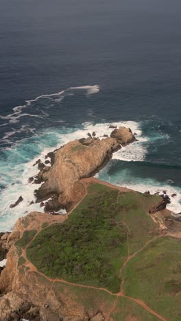 Vertical-aerial-view-of-the-cliffs-at-Punta-Cometa,-Mazunte,-Oaxaca,-Mexico