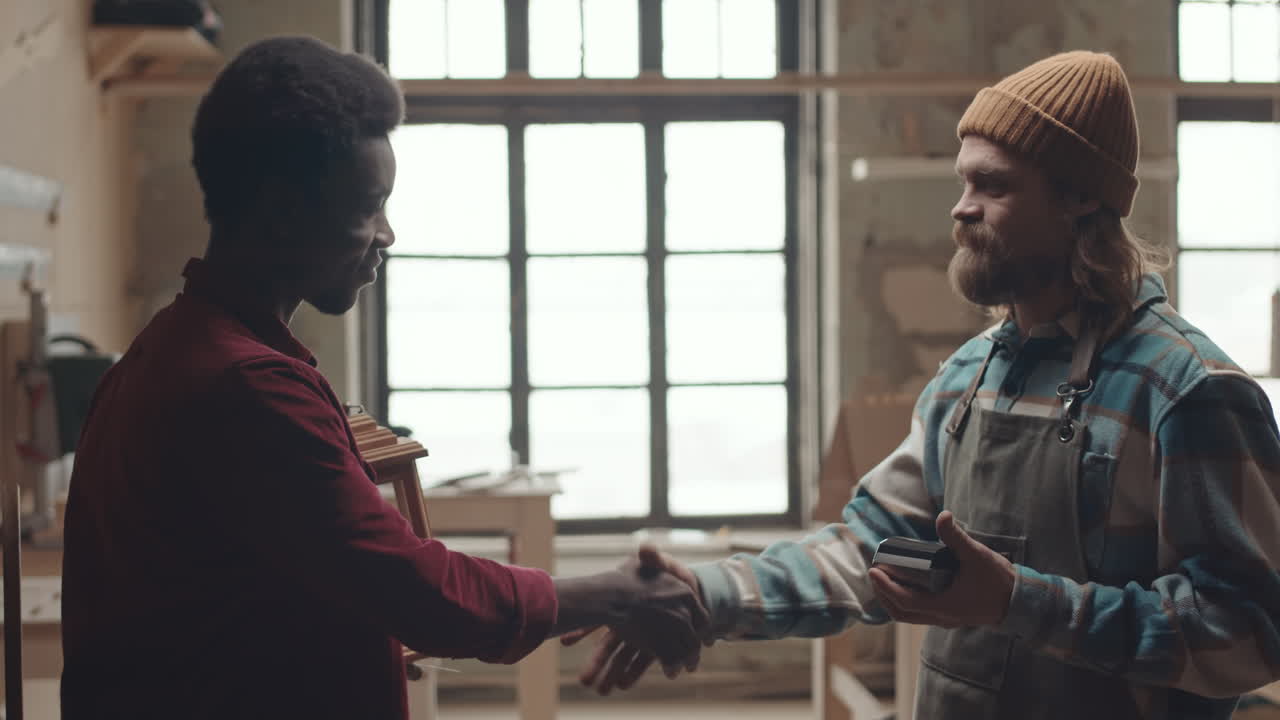 African American Customer Paying Carpenter for Handmade Lantern