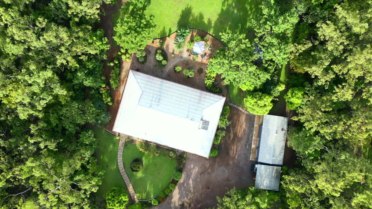 Aerial Drone of Tropical Rural Estate Large Block Property with Grassy Backyard and Long Shadows from Trees