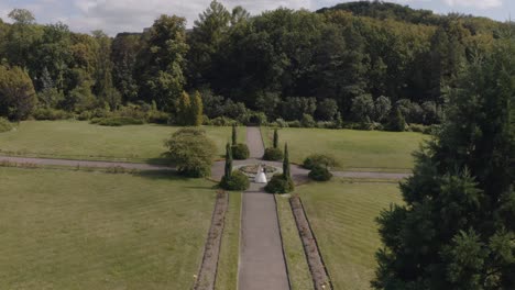 Newlyweds,-Caucasian-groom-with-bride-walking,-embracing,-hugs-in-park,-Wedding-couple