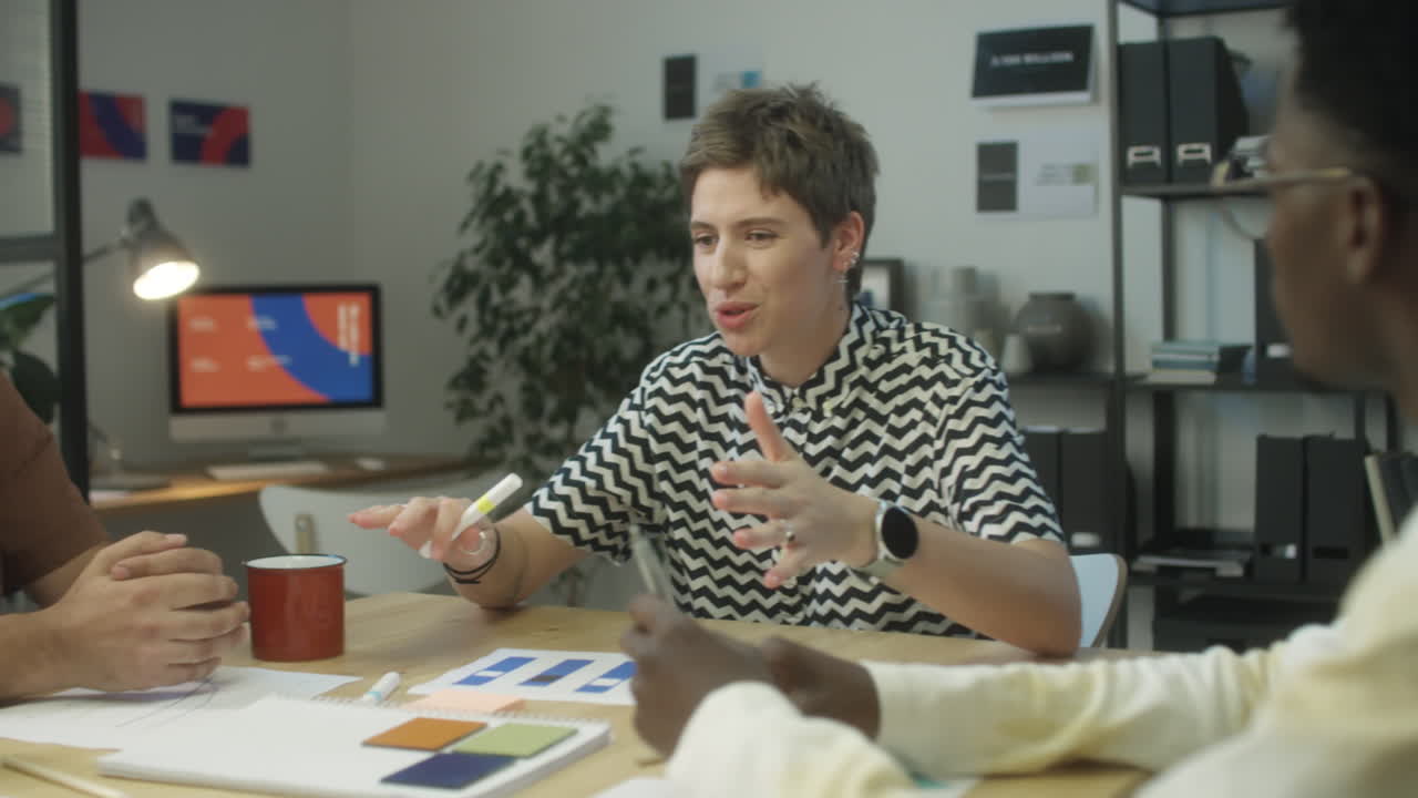 Woman Talking with Multiethnic Coworkers on Meeting