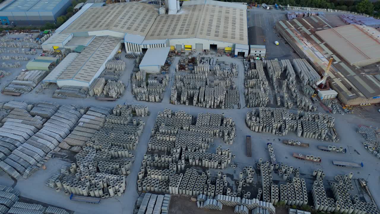 Aerial drone view of industrial concrete casting factory and production site in Coalville UK with manufacturing infrastructure and equipment