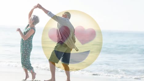 happy retired couple dancing on the beach for saint valentines day