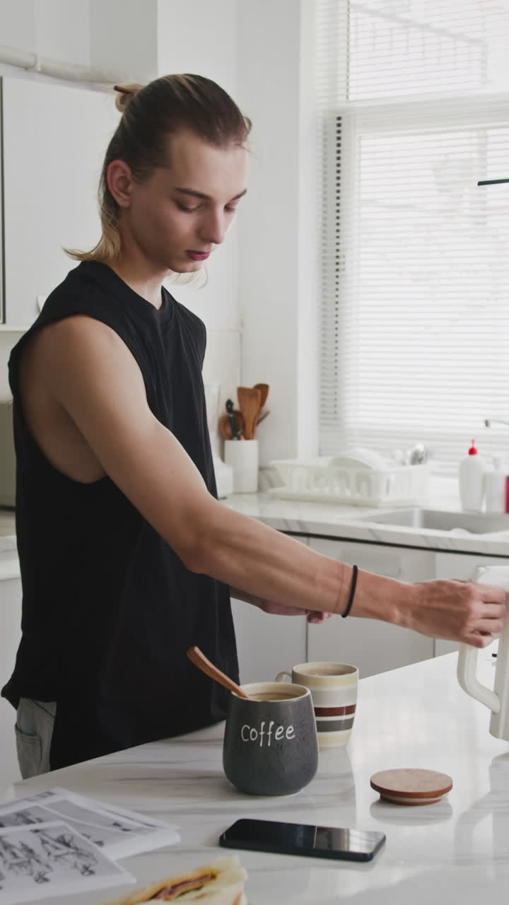 Vertical of Gen Z Designer Preparing Breakfast at Home