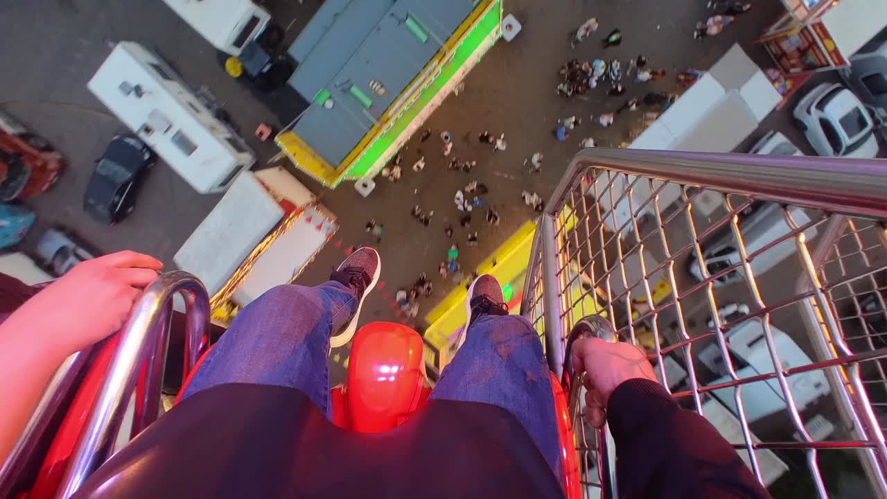 POV, Excited Young Adults Enjoying A Pendulum Fun Ride at Traveling Carnival