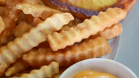 Close-Up-Footage-of-French-Fries-and-Toasted-Bread-Served-With-Mayo-Dipping-Sauce