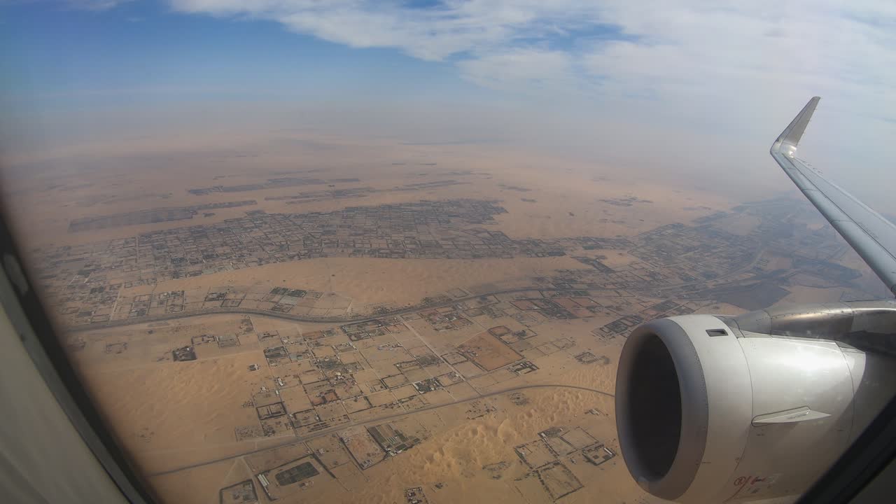 Airplane Window View Above the City