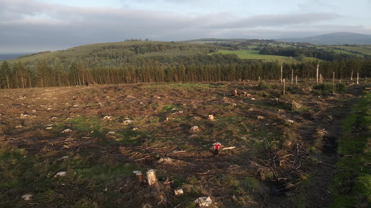 Drone shot showing deforestation in effect on a hill in Ireland