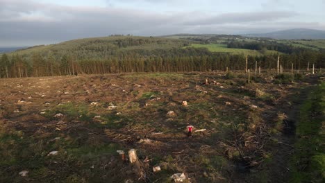 drone shot showing deforestation in effect on a hill in ireland