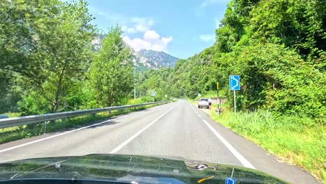 driving through lush, mountainous piedmont, italy