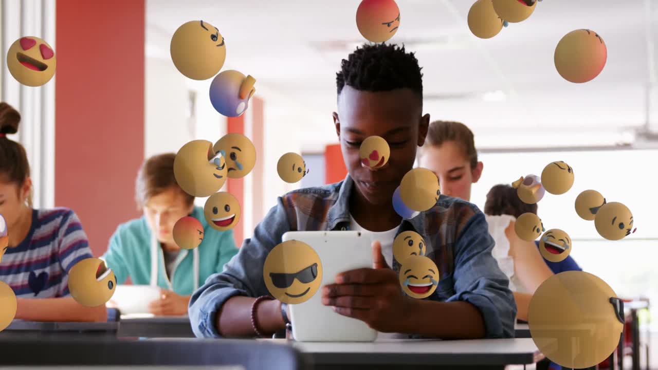 Animation of emoticons over diverse students in class using tablets