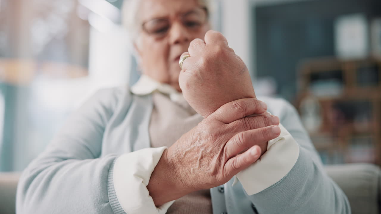 Elderly woman experiencing wrist pain