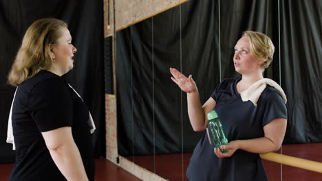 women talking after training