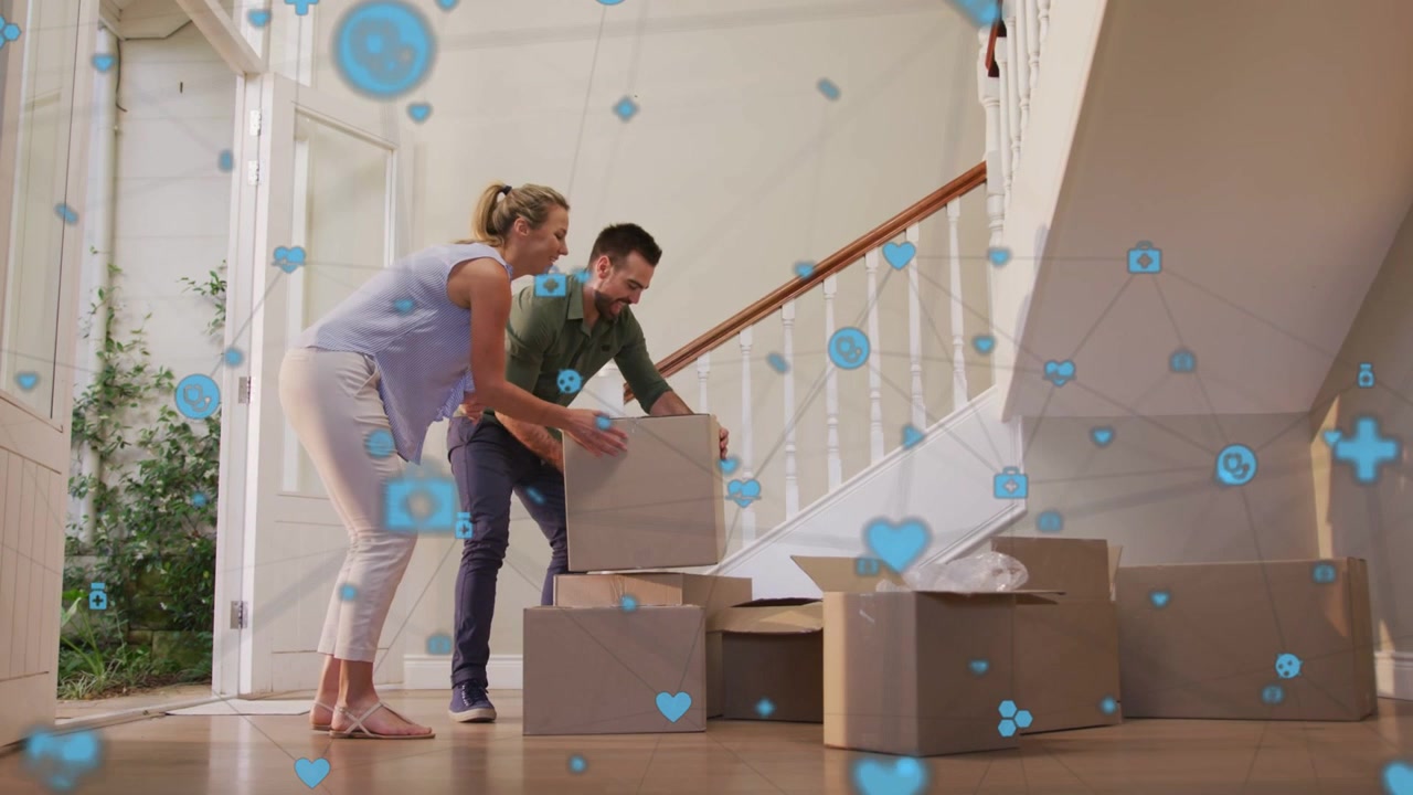 Couple entering with box stacking boxes amid home move blue heart cam icons partly hiding actions