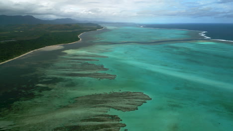 wide aerial over lagoon off poé beach towards shark fault, western new caledonia