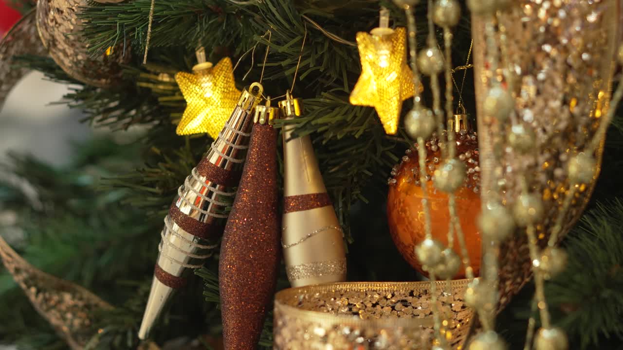 Close-up of Elegant Gold and Brown Christmas Tree Ornaments