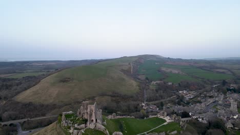 aerial forward over corfe norman castle remains and surrounding landscape, dorset county in england