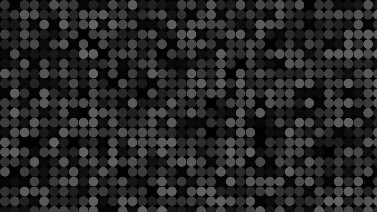 Flashing circular dots on black background.