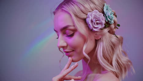 beautiful blonde woman with flowers in hair and soft pastel lighting