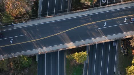 an aerial, top down view over a highway in slow-motion