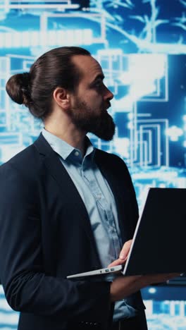 vertical video young entrepreneur reviewing predictive analytics and machine learning