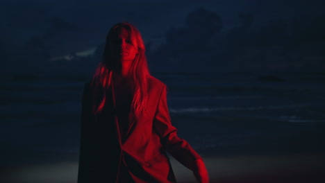 attractive girl night shore in red neon closeup. festival party woman outdoors.