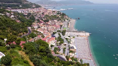 Aerial-shot-pan-forward-revealing-a-city-in-Amalfi-Coast-in-the-Mediterranean-Sea
