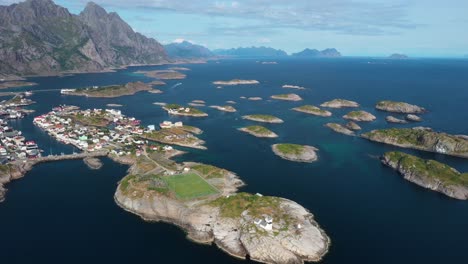 aerial of henningsvaer municipality settled on few small lofoten islands, norway