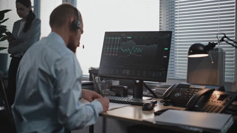 business person analyzing stock market data in office