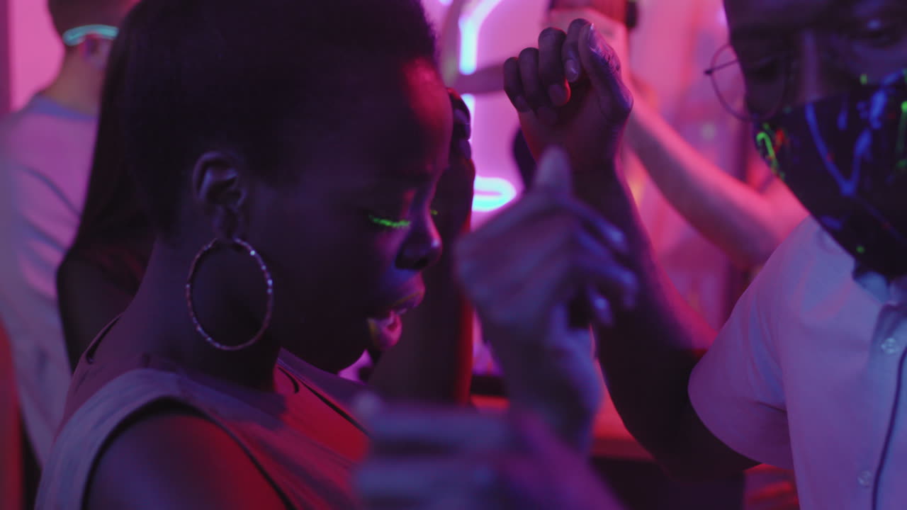 Black Man and Woman Dancing at Party