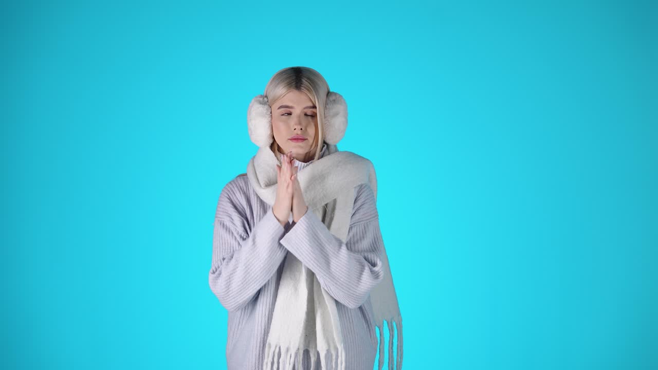 Young Blonde Woman Wearing Winter Clothes, Feeling Cold, Colorful Studio Portrait