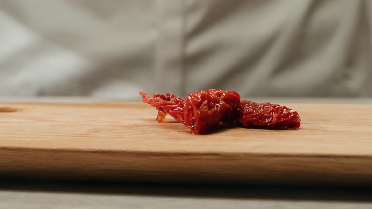 Chef preparing sun-dried tomatoes