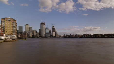 time lapse of river thames boat traffic, canary wharf, docklands, isle of dogs, london, uk