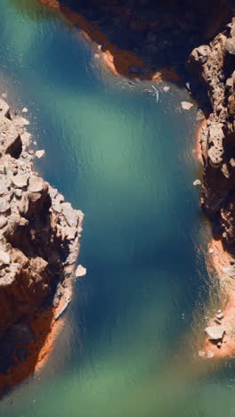 aerial view of a canyon with a river flowing through it