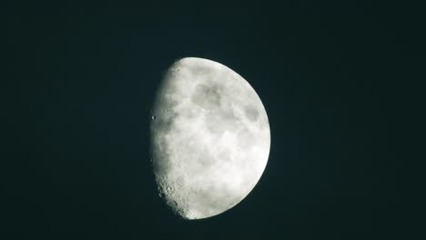 moon at night with cloud real time. 4k video moon in the black sky.  clouds passing by moon at night. night sky with cloudy weather