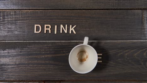 Cup-of-black-coffee-on-wooden-table