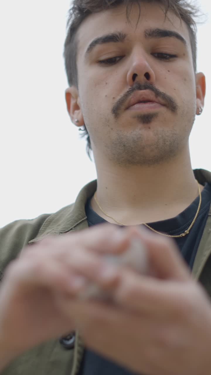 A young man holding an object