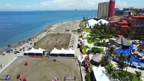 aerial view of a show jumping competition on the beach