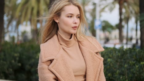 young woman standing in the street.