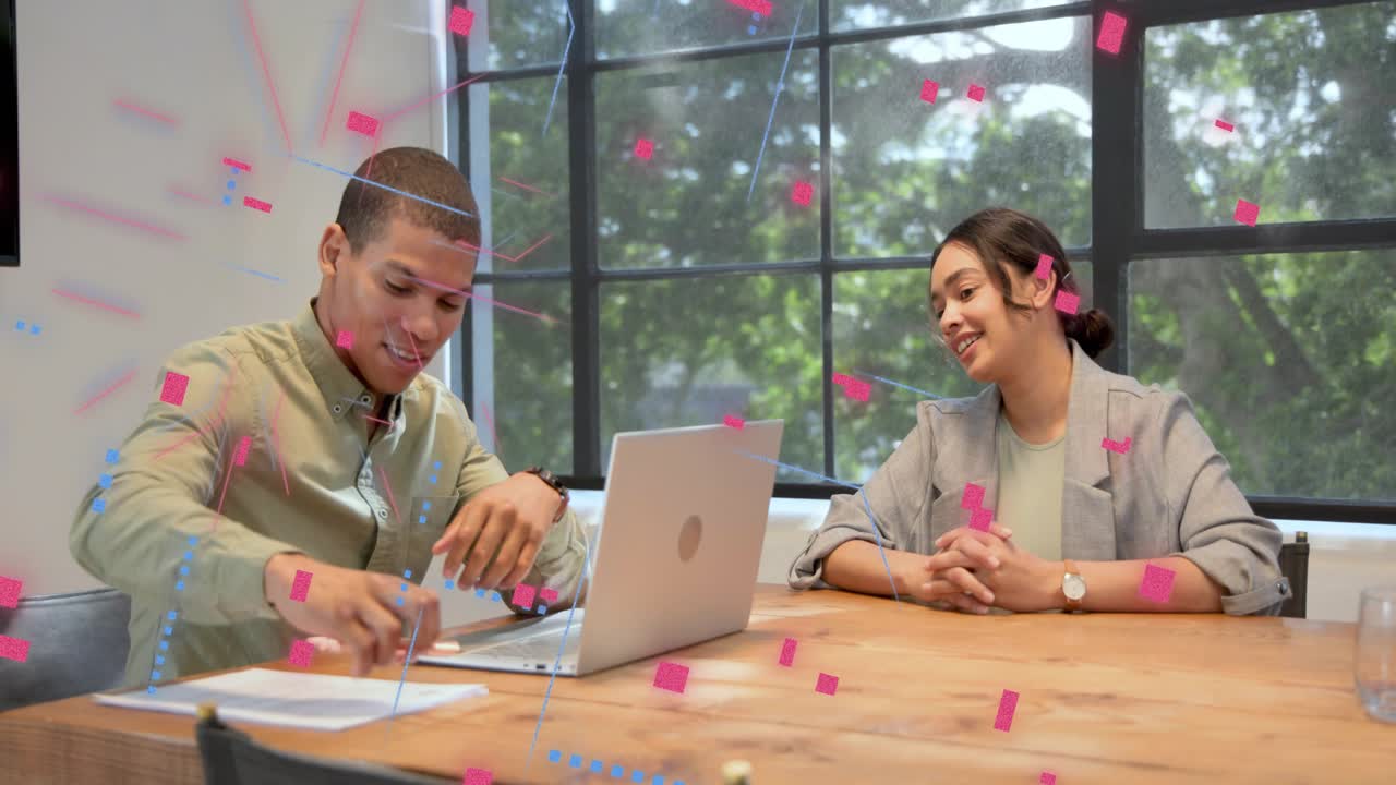 Man speaking from laptop to colleague, discussing business while blue pink graphics floating around